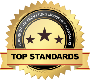 Goldenes Qualitätssiegel mit Sternen und dem Schriftzug „Top Standards – ausgeprägte Einhaltung moderner Standards“.